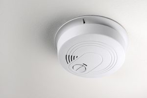 Smoke detector mounted on the ceiling.